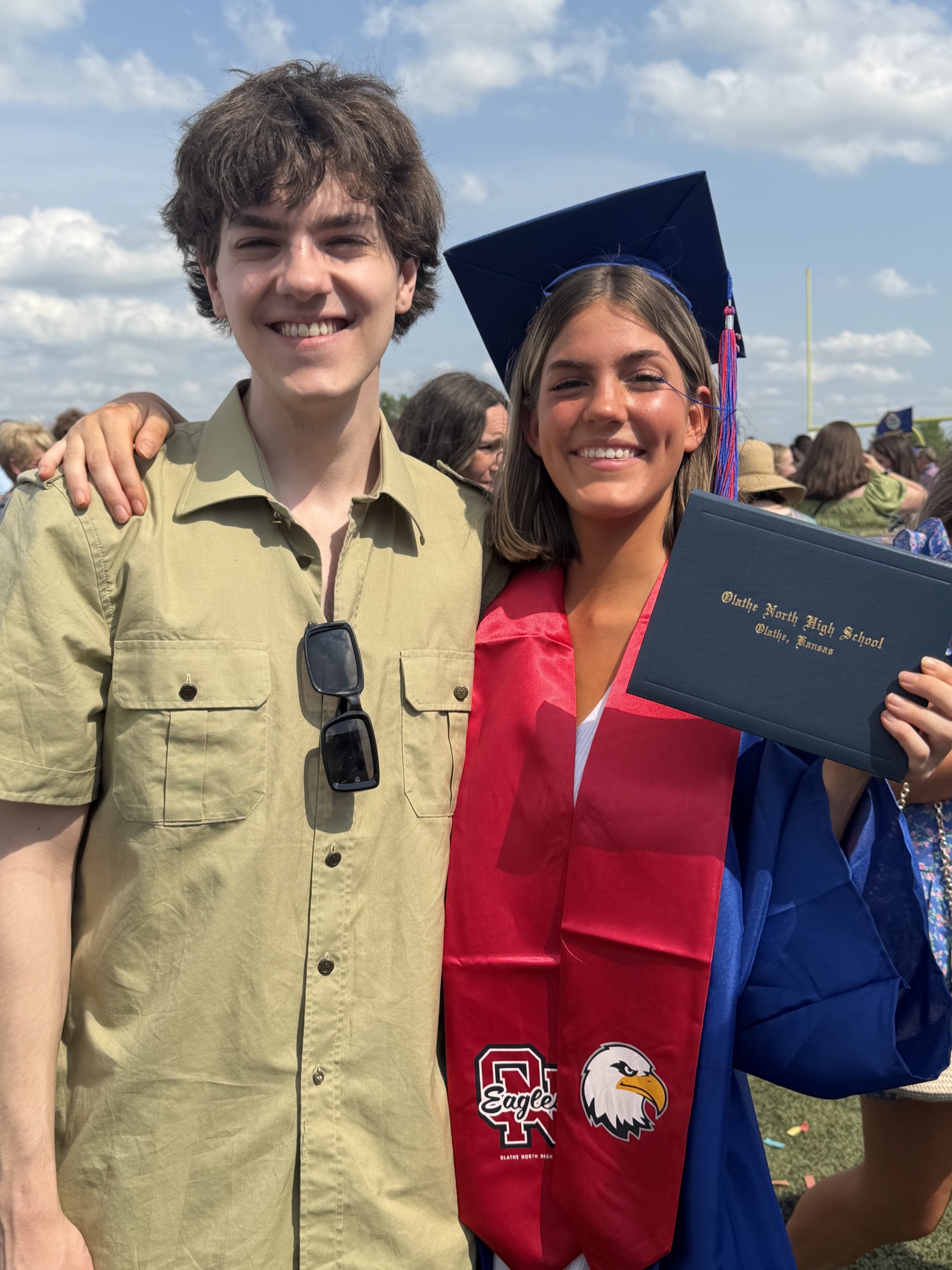 Chris's daughter Maci at her high school graduation, May 2026, with her older brother